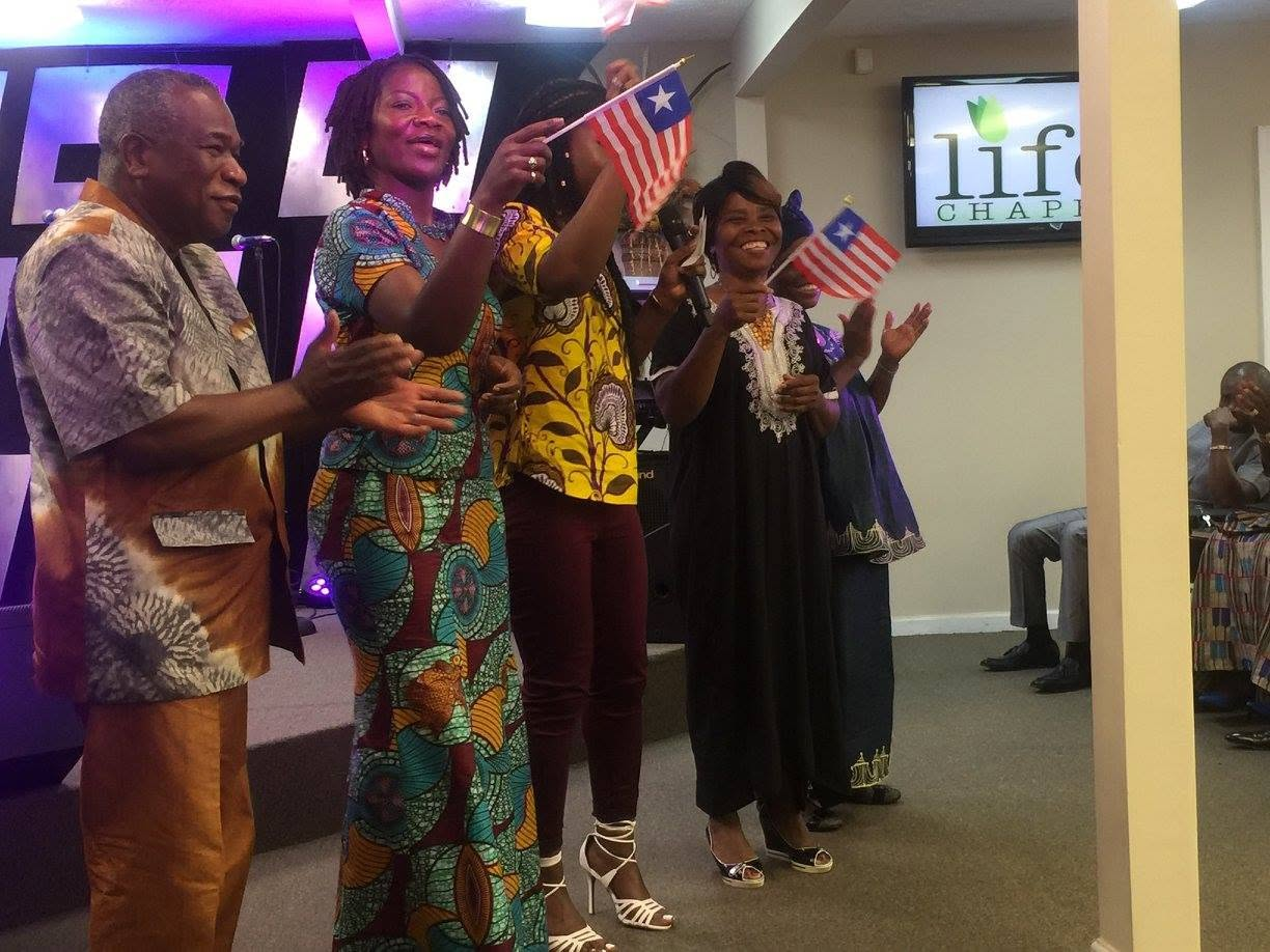 Life Chapel congregation celebrating with flags in 2016