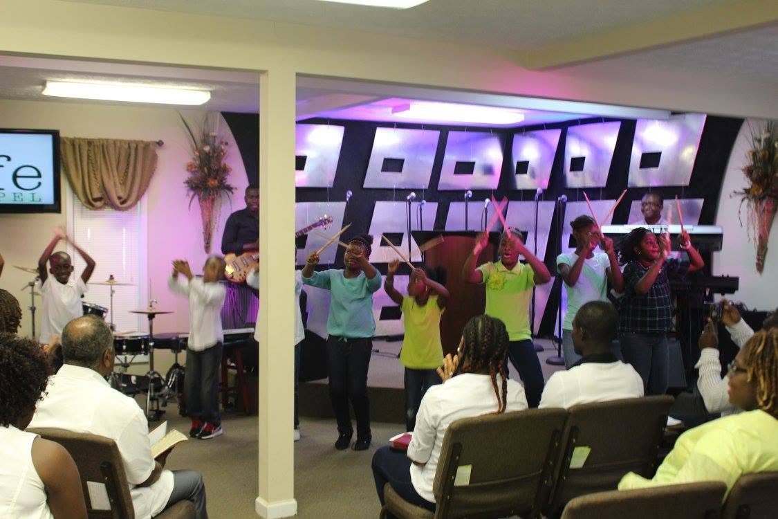 Life Chapel children and youth worshipping in 2015