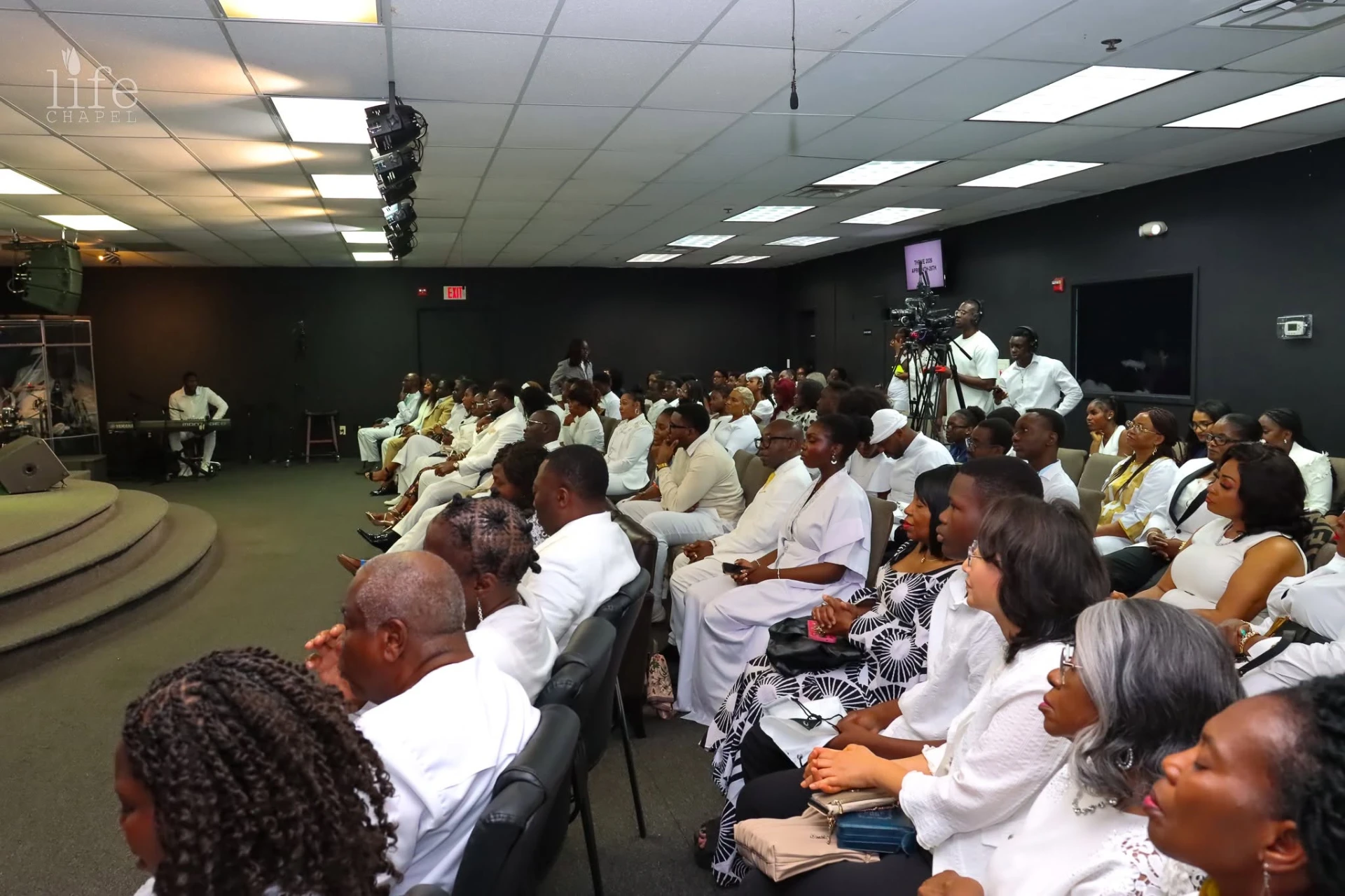 Congregation worshipping together at Life Chapel